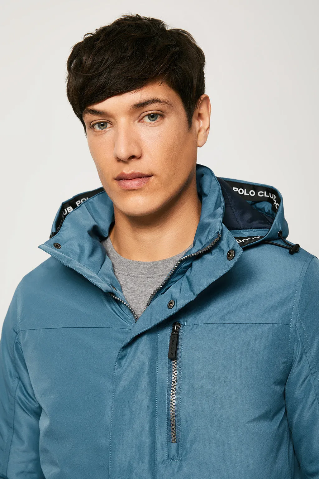 Parka azul petróleo apres ski con capucha y cuello elevado