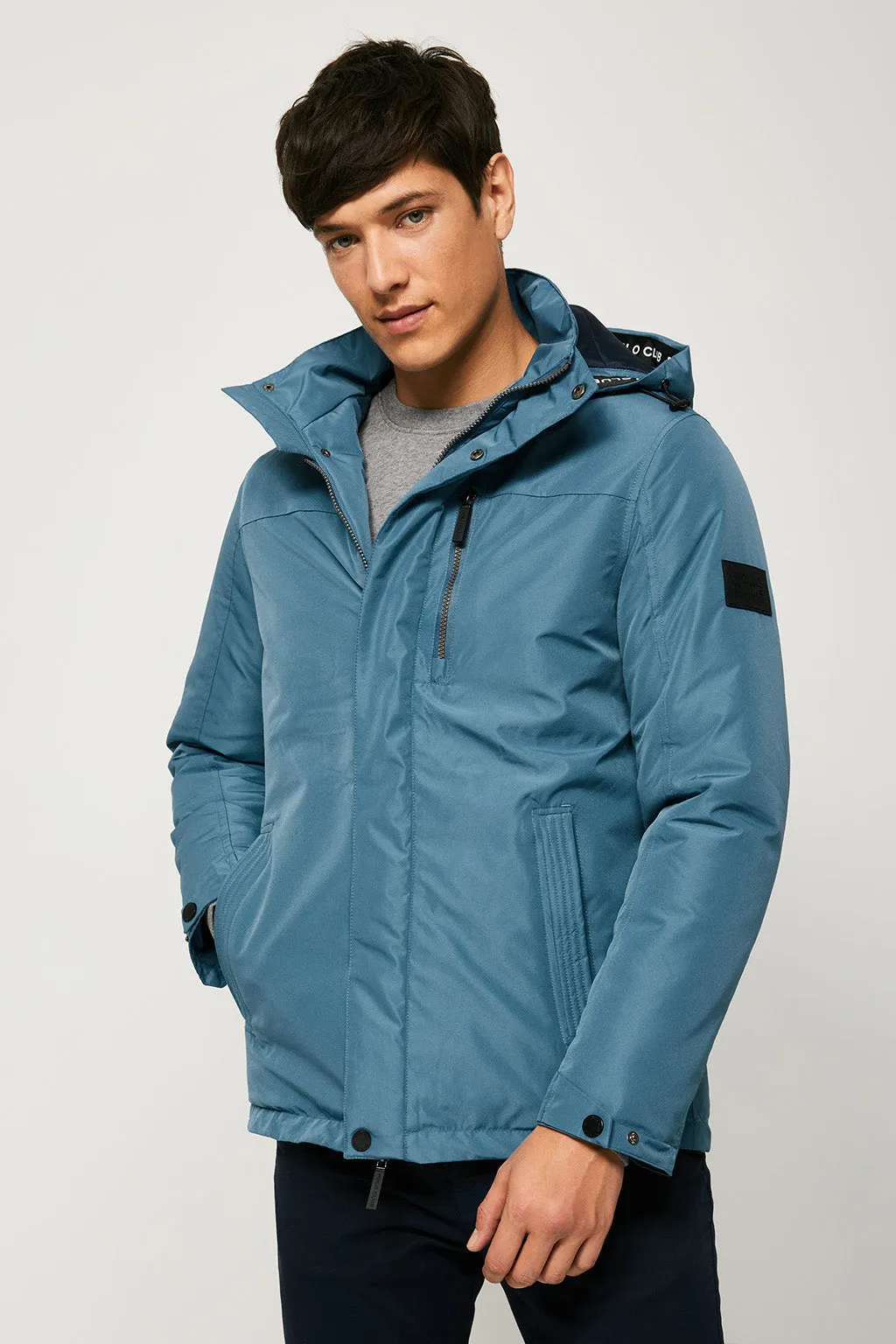 Parka azul petróleo apres ski con capucha y cuello elevado